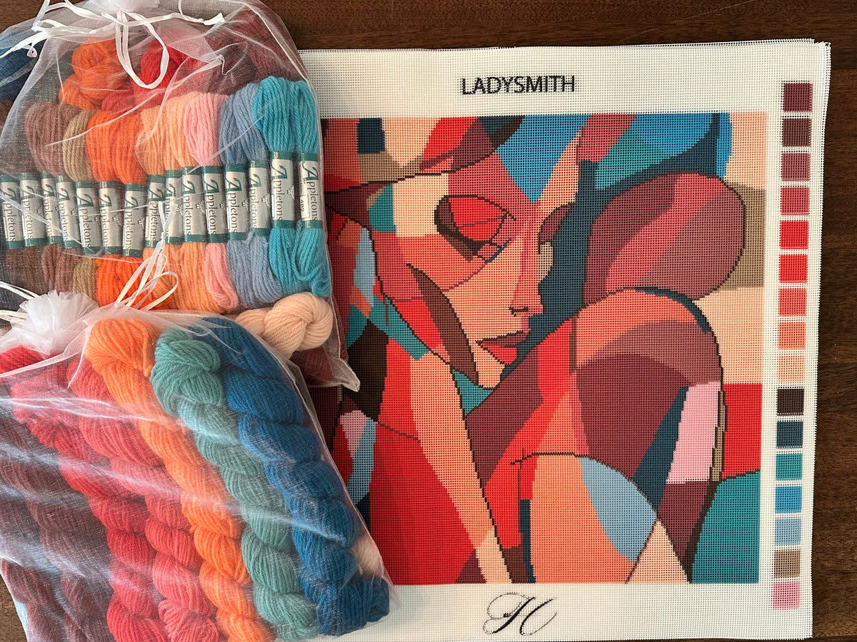 The Ladysmith canvas beside two bags of Appleton's tapestry wool